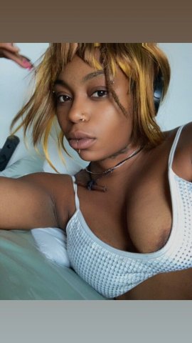 Well-versed Ebony escort in a dress — Manhattan car dates - 1